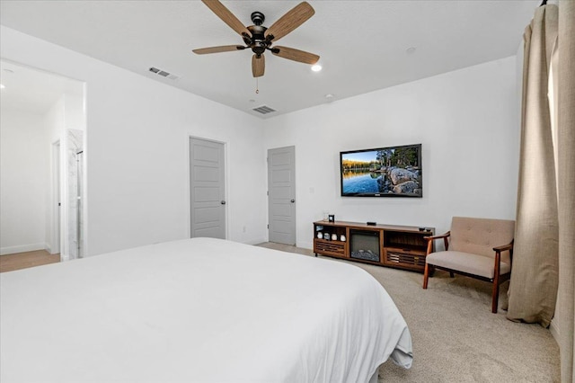 bedroom with light carpet and ceiling fan