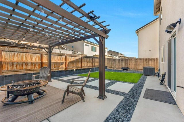 view of patio with a pergola, central air condition unit, and an outdoor fire pit