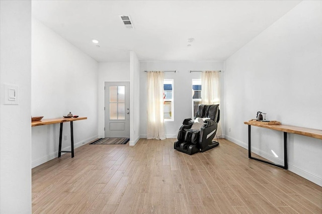 living area with light hardwood / wood-style floors