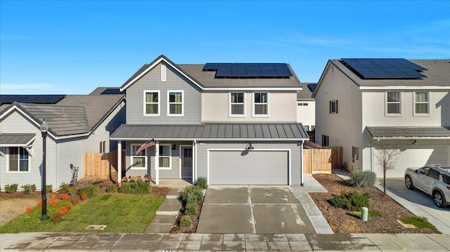 view of front of house featuring a garage, covered porch, a front yard, and solar panels