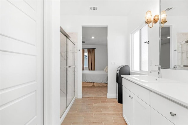 bathroom with vanity and walk in shower