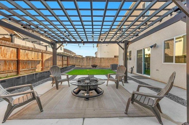 view of patio / terrace featuring cooling unit, a pergola, and an outdoor fire pit