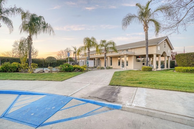 view of front of property with a lawn