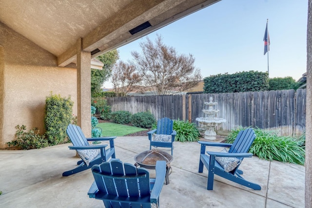 view of patio featuring an outdoor fire pit