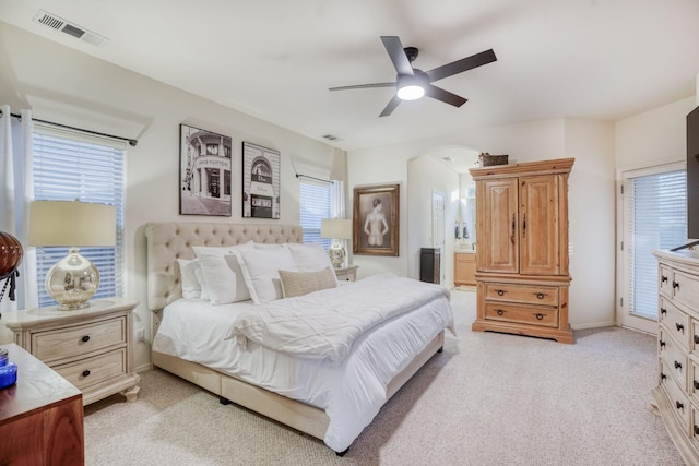 bedroom featuring light colored carpet and ceiling fan