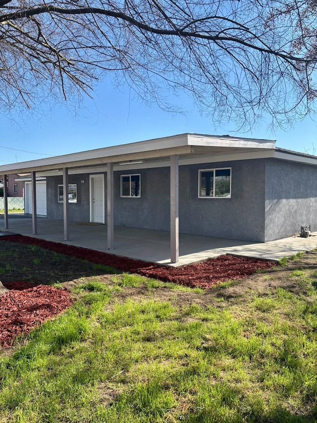 exterior space featuring a yard and a patio