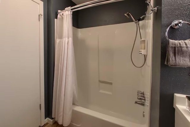 bathroom featuring shower / bath combo with shower curtain