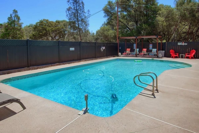 view of swimming pool featuring a patio