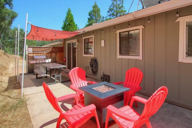 view of patio / terrace with a fire pit