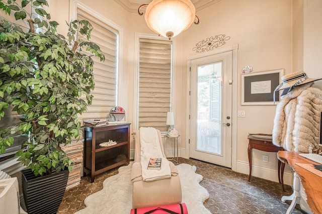 doorway featuring crown molding