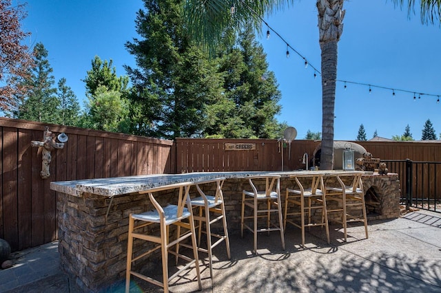 exterior space featuring an outdoor bar