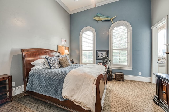 bedroom with crown molding and light colored carpet