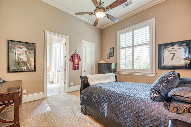 bedroom featuring ceiling fan, ornamental molding, and ensuite bathroom