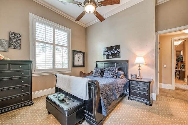 carpeted bedroom with ornamental molding and ceiling fan