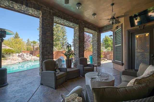 view of patio with a fenced in pool, an outdoor hangout area, and ceiling fan