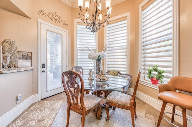 tiled dining area featuring crown molding and a chandelier