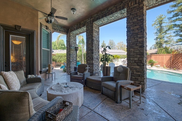 view of patio featuring a fenced in pool, outdoor lounge area, and ceiling fan