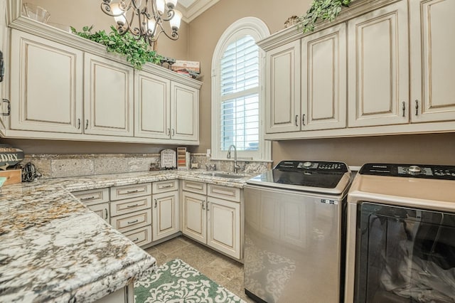 laundry room with sink, crown molding, cabinets, independent washer and dryer, and light tile patterned flooring