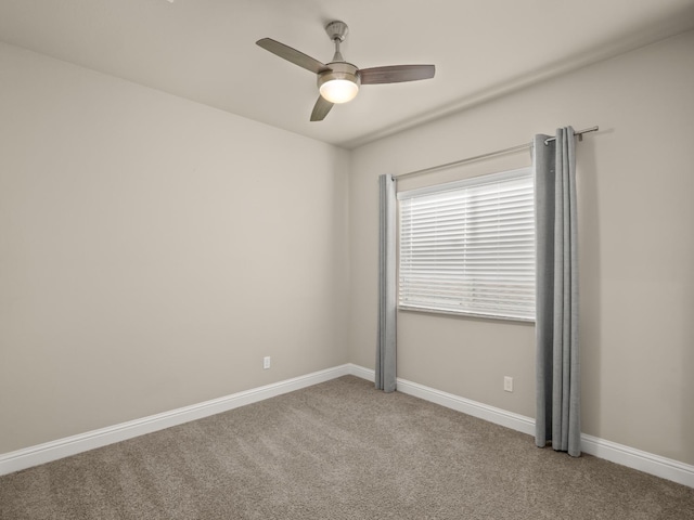 empty room featuring ceiling fan and carpet flooring