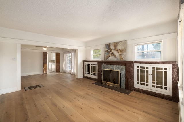 unfurnished living room with wood-type flooring