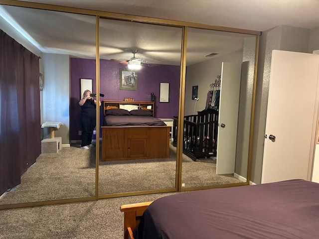 carpeted bedroom featuring a closet