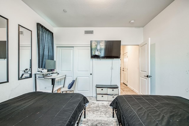 bedroom featuring a textured ceiling