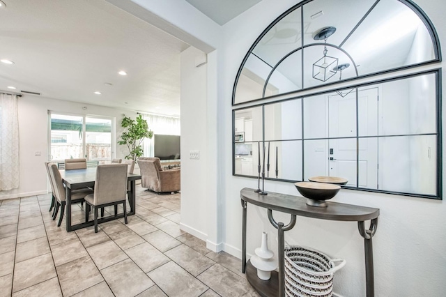 dining area with light tile patterned floors