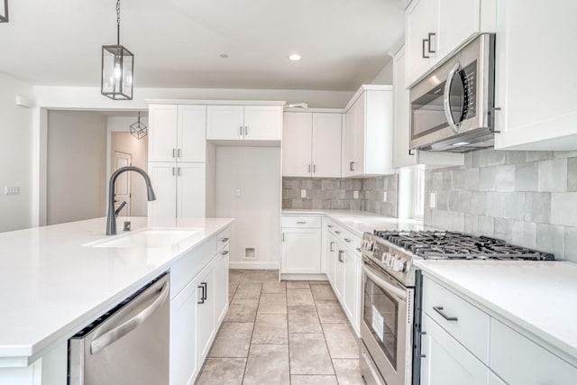 752 Katelyn Ave, Madera, CA 93636 - kitchen featuring a sink, stainless steel appliances, backsplash, and light countertops