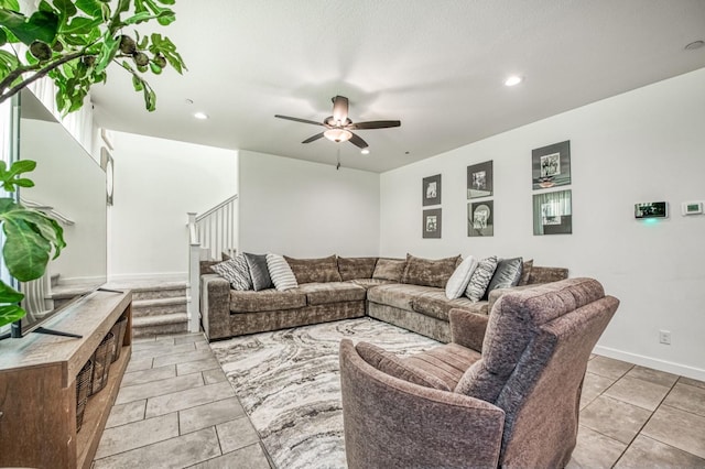 tiled living room with ceiling fan