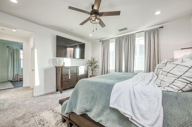 bedroom with light carpet and ceiling fan