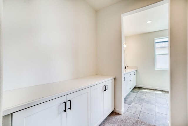 752 Katelyn Ave, Madera, CA 93636 - bathroom with baseboards, tile patterned floors, and vanity