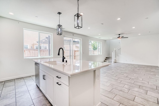 752 Katelyn Ave, Madera, CA 93636 - kitchen featuring a sink, baseboards, light countertops, and recessed lighting