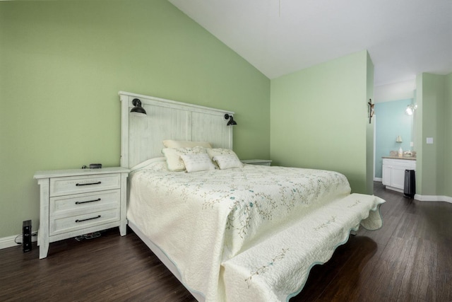 bedroom with lofted ceiling and dark wood-type flooring