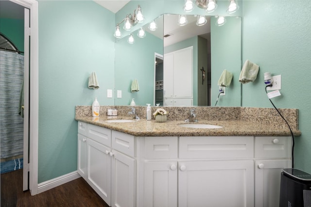 bathroom featuring vanity, hardwood / wood-style floors, and a shower with curtain