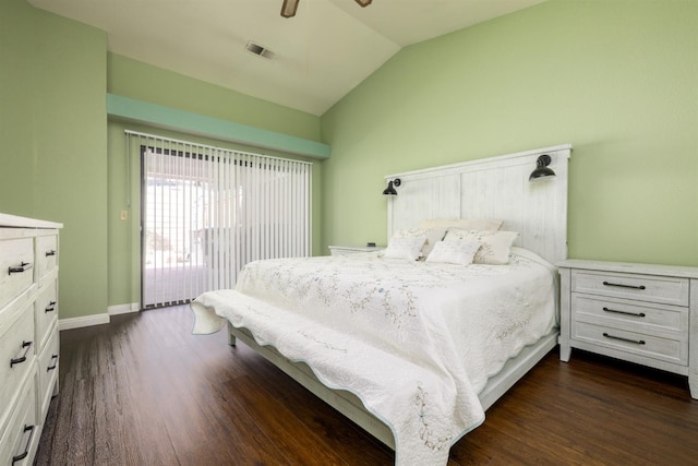 bedroom featuring ceiling fan, dark hardwood / wood-style floors, and vaulted ceiling