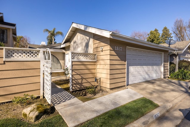 view of side of home featuring a garage