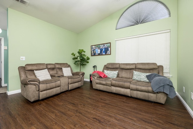 living room with dark wood-type flooring and vaulted ceiling