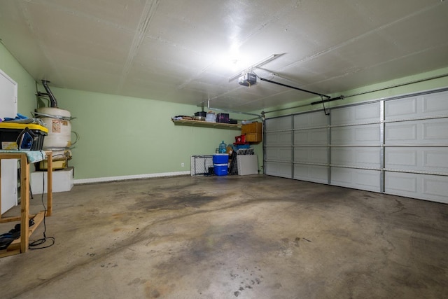 garage with a garage door opener and water heater