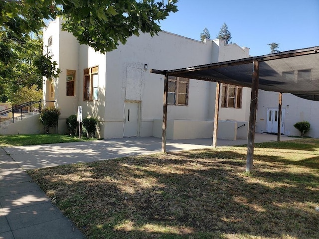 view of side of home featuring a yard