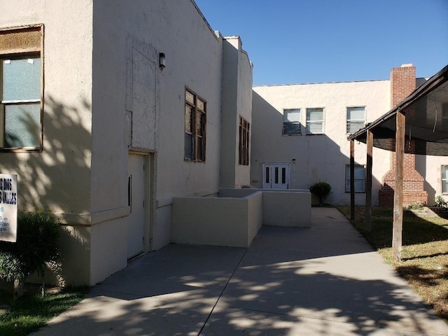 view of home's exterior with a patio and stucco siding