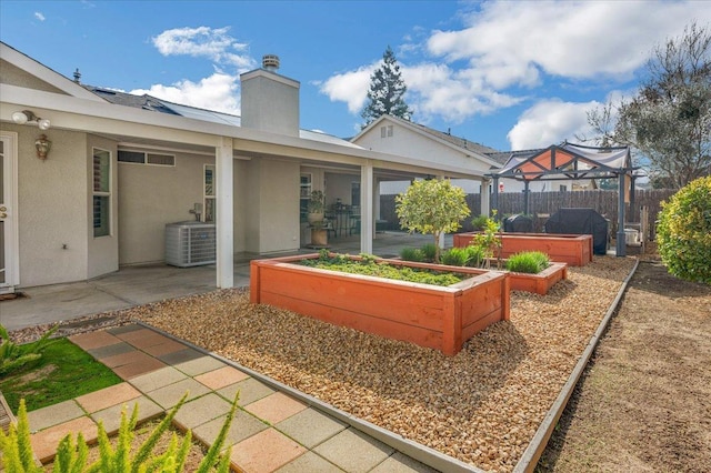 exterior space featuring cooling unit and a hot tub