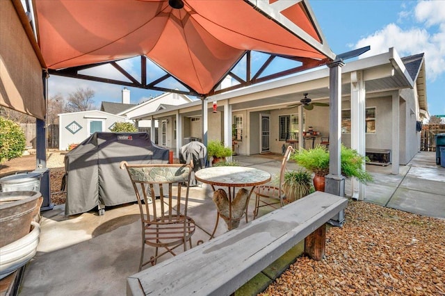 view of patio / terrace featuring a grill and ceiling fan