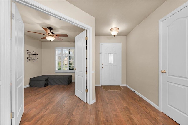 entryway with hardwood / wood-style flooring and ceiling fan