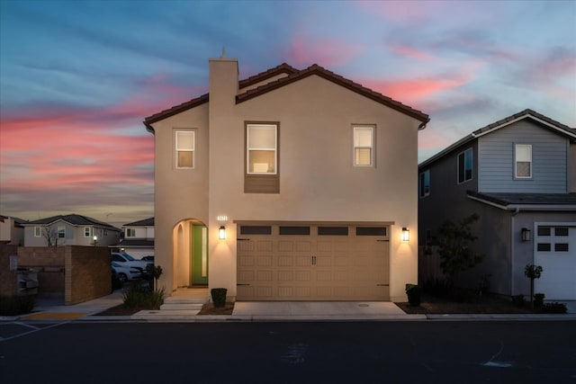 front facade with a garage