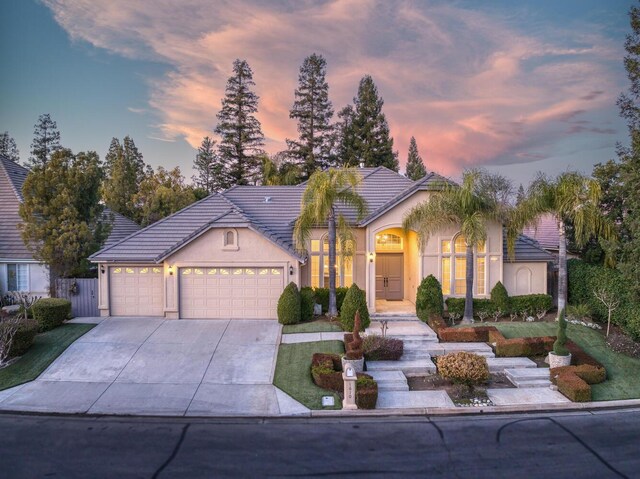 ranch-style home featuring a garage