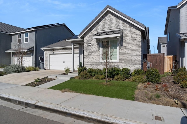 view of front facade with a garage and a front lawn