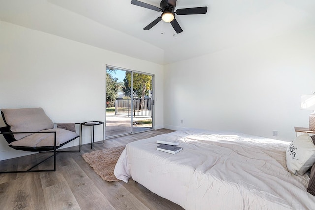 bedroom featuring ceiling fan, light wood-type flooring, and access to exterior