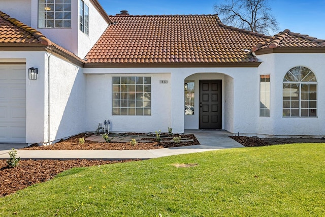 mediterranean / spanish home with a front lawn