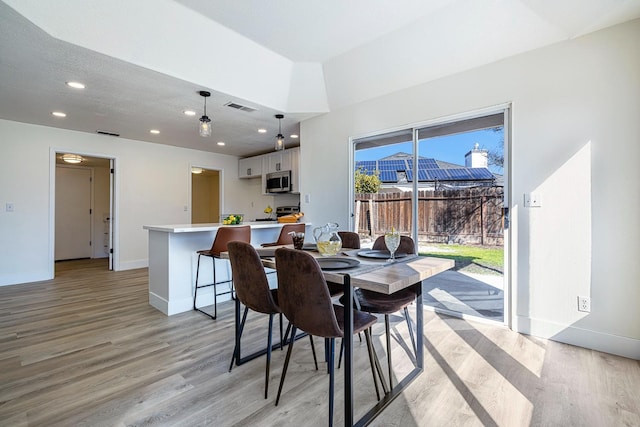 dining room featuring light wood-type flooring