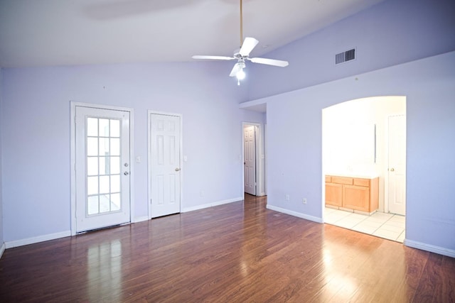 unfurnished room with ceiling fan, dark hardwood / wood-style floors, and high vaulted ceiling